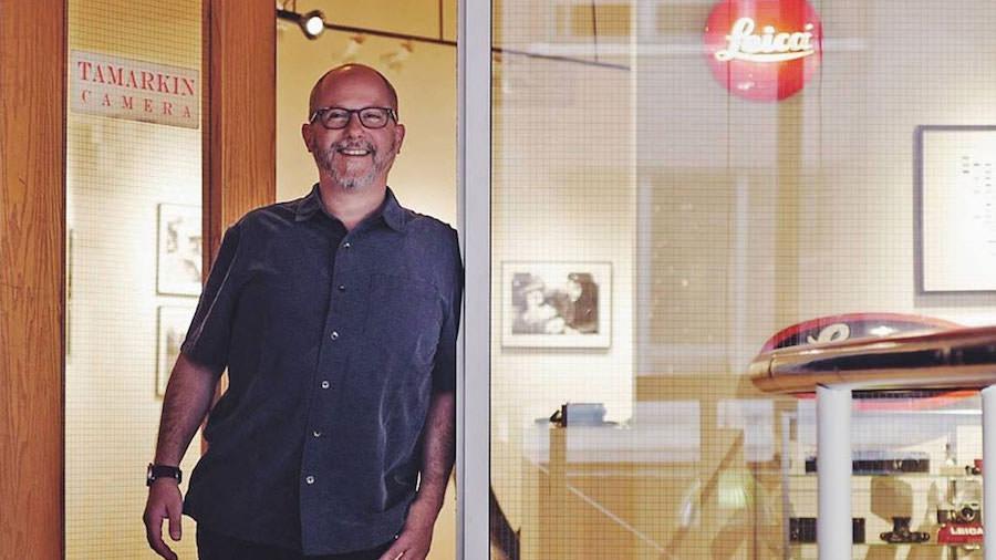 Dan Tamarkin standing in the doorway to Tamarkin Camera and The Rangefinder Gallery